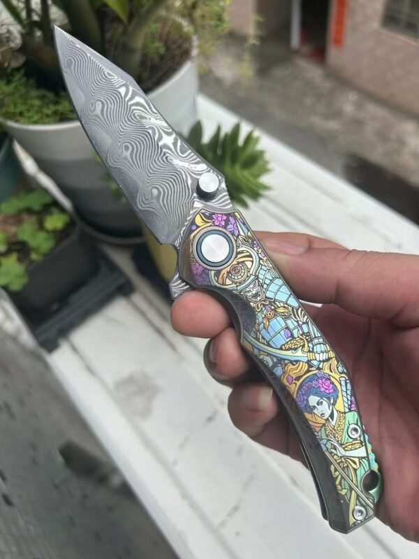 Dark vg10 Damascus steel folding knife with titanium handle, exquisitely engraved