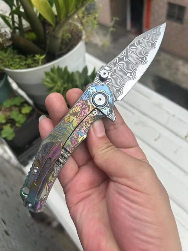 Dark vg10 Damascus steel folding knife with titanium handle, exquisitely engraved - Image 9