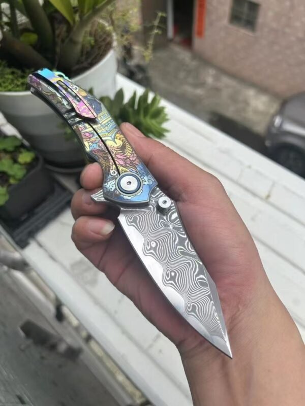 Dark vg10 Damascus steel folding knife with titanium handle, exquisitely engraved - Image 7