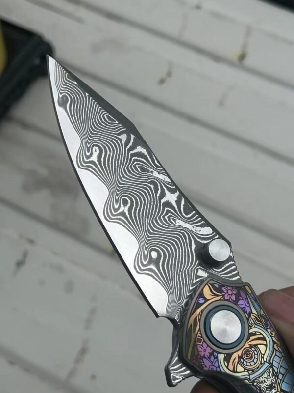 Dark vg10 Damascus steel folding knife with titanium handle, exquisitely engraved - Image 5