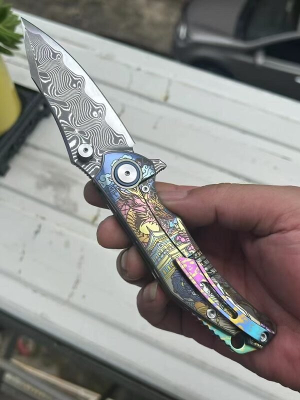 Dark vg10 Damascus steel folding knife with titanium handle, exquisitely engraved - Image 4